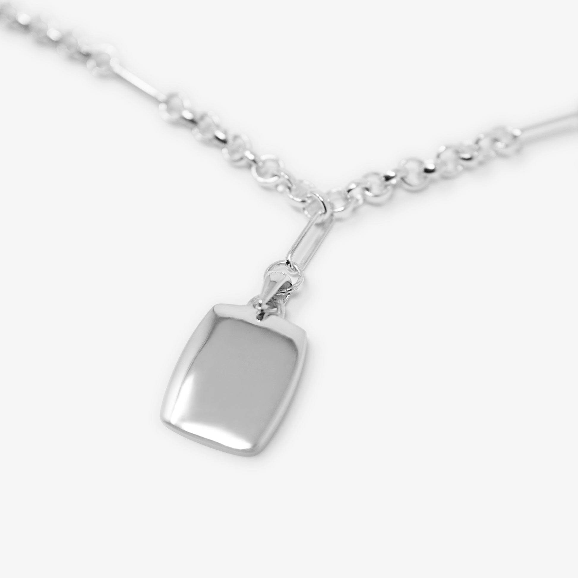 Detailed image of the Figaro Pendant Necklace in sterling silver by jewellery brand Skomer Studio